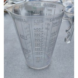 A kitchen measuring cup is plastic